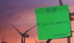 Banner with wind turbines image and then a green sticky note on the right-hand side