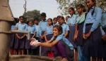 Schoolgirl washing hands