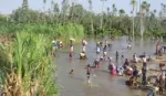 Villagers in Magadgascar using river for drinking water and domestic use